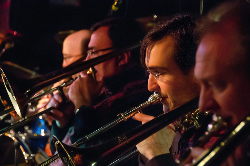 Several members of the Easy Street Big Band playing their instruments